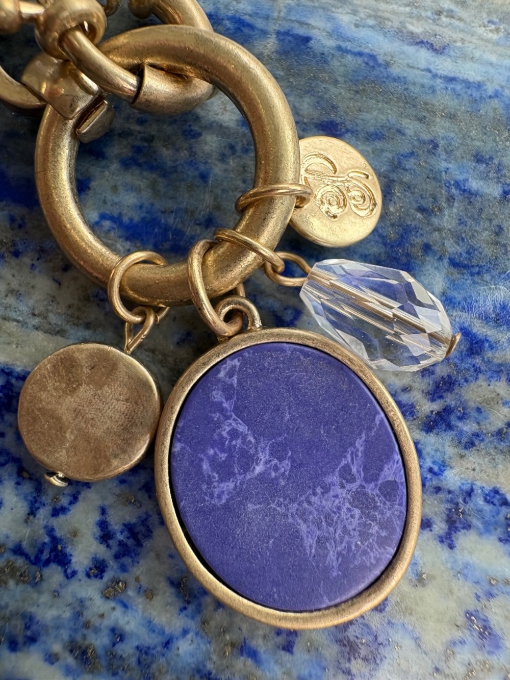Goldtone Bracelet with a Blue Glass Charm by Plunder Design Private Label